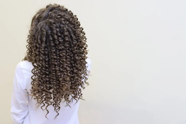Joyful woman with defined curls